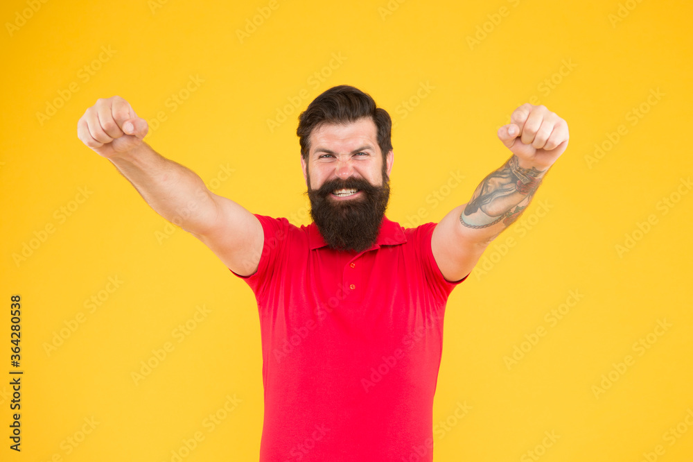 Joyful guy. Inner energy. Motivated for success. Happy man show success gesture yellow background. Victory and success. Bearded man in casual style celebrating. Happiness and joy. Winner and victory Joyful guy. Inner energy. Motivated for success. Happy man show success gesture yellow background. Victory and success. Bearded man in casual style celebrating. Happiness and joy. Winner and victory