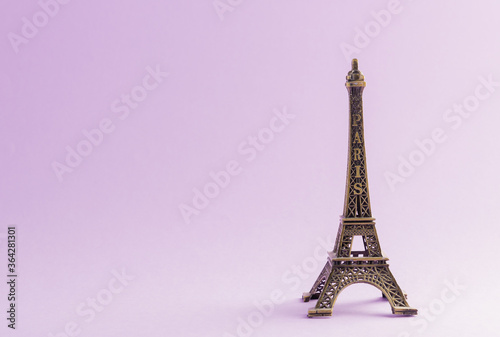 Fototapeta Naklejka Na Ścianę i Meble -  Paris France monument Eiffel tower famous landmark model, studio shot isolated on purple background
