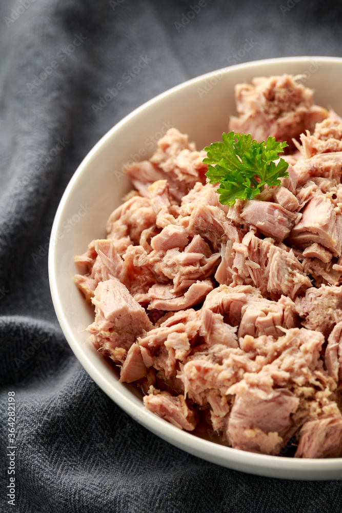 Canned tuna fish in white bowl with omega 3 Canned tuna fish in white bowl with omega 3
