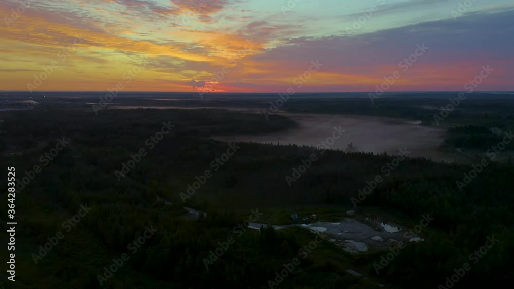 panoramic view around the bright orange dawn over the Northern regions of Russia, gas and oil production, Khanty-Mansi Autonomous Okrug. White night.