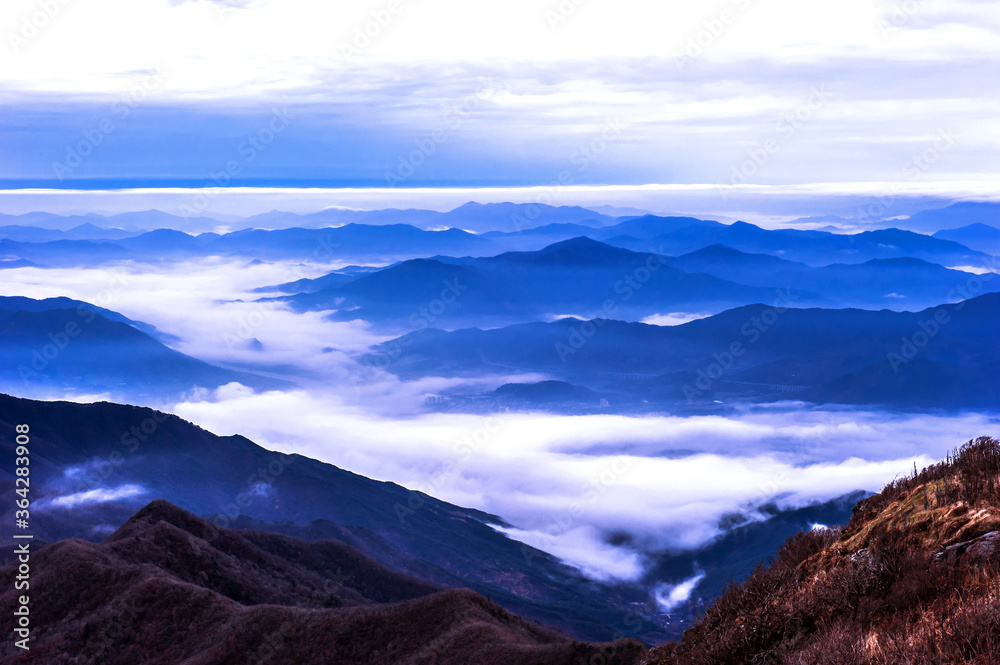 Fototapeta premium Beautiful sea of clouds at dawn on the top of the mountain.