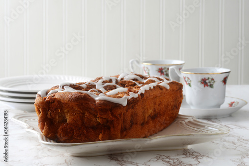 apple fritter loaf cake with icing sugar