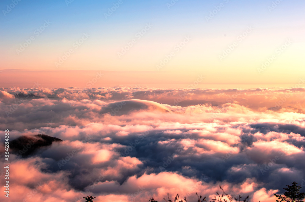 Beautiful sea of clouds at sunset on the top of the mountain.