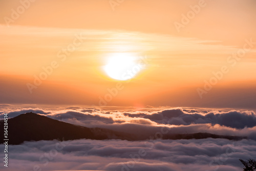 Beautiful sea of clouds at sunset on the top of the mountain. © Chongbum Thomas Park