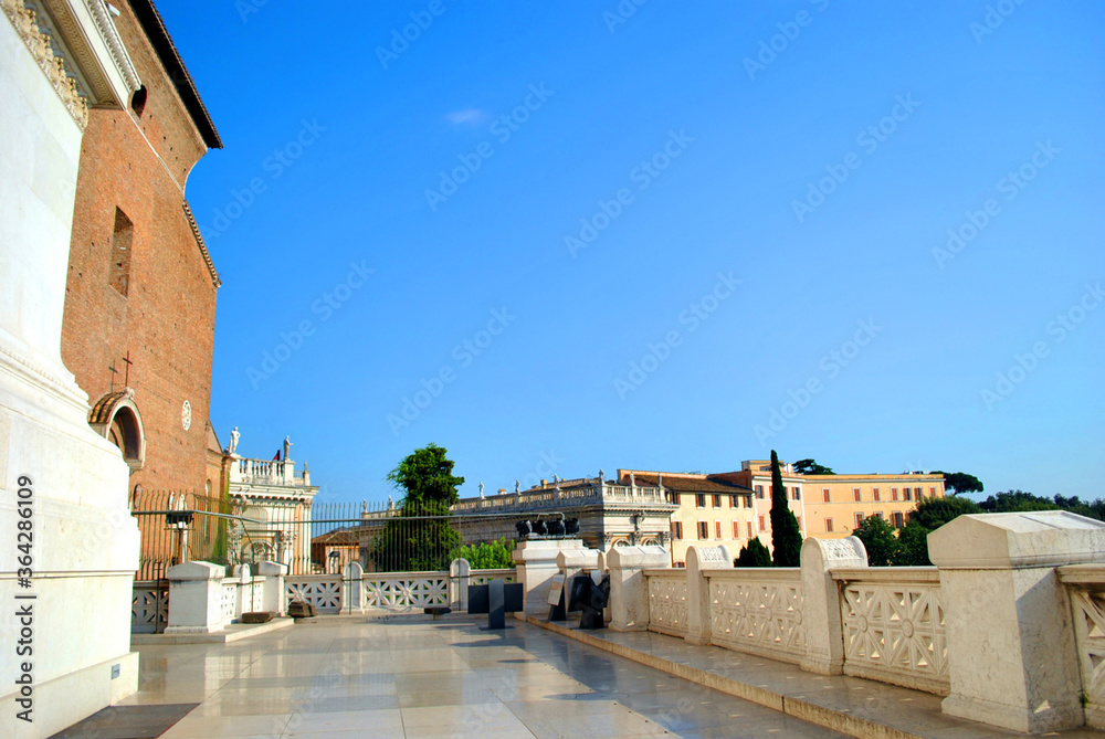 Perspective view of the Vittoriano's terrace and architectural monuments such as the right wing propylaea and facade of ​​the Santa Maria in Ara Coeli.