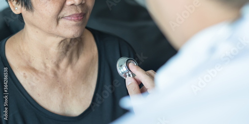 Elderly patient heart health check by medical geriatric doctor for awareness in stroke systolic high blood pressure, hypertension, hypotension and cardiovascular disease in aged senior older woman