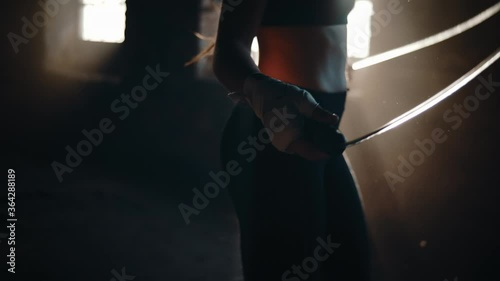 Woman jumping rope in a building