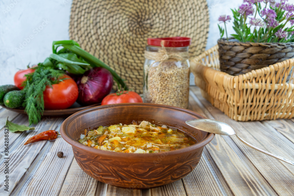 Vegetable soup with pearl barley. Rustic still life. Vegetable soup with pearl barley. Rustic still life.