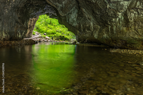 Rak river flowing through the cave in Rakov Skocjan gorge, Slovenia