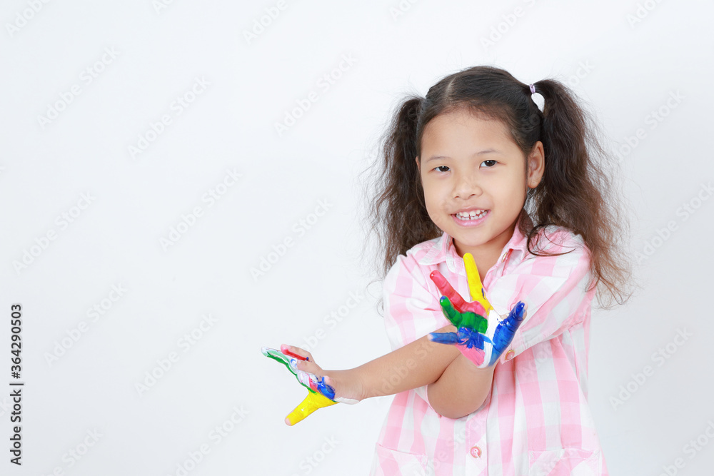 Portrait Asian kid girl cute looking a camera painting colorful her fingers isolated on white background with copy space. Learning artistic to develop ideas and inspire. Concept school education, art. Portrait Asian kid girl cute looking a camera painting colorful her fingers isolated on white background with copy space. Learning artistic to develop ideas and inspire. Concept school education, art.