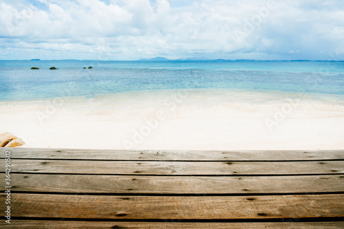 Top of wood table with seascape and blue sky