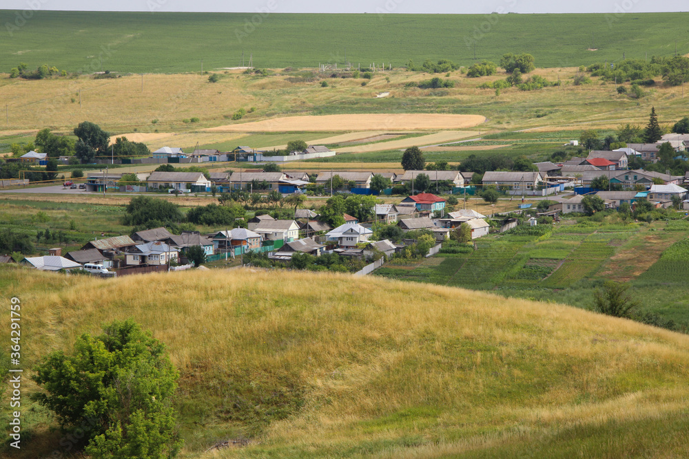 Beautiful view of a Russian village from the hill. Lovely little houses.