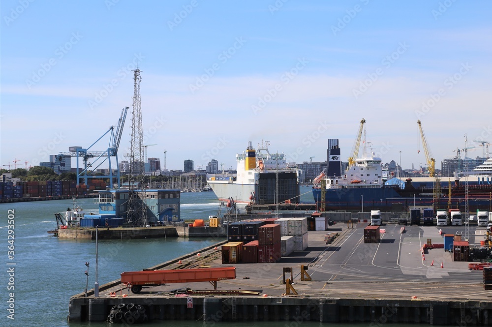 A container ship on the River Liffey reversing into the quay at the port of Dublin, Ireland. A container ship on the River Liffey reversing into the quay at the port of Dublin, Ireland.