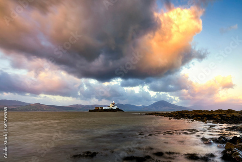 Old lighthouse, surrounded by mountains, Fenit, Ireland