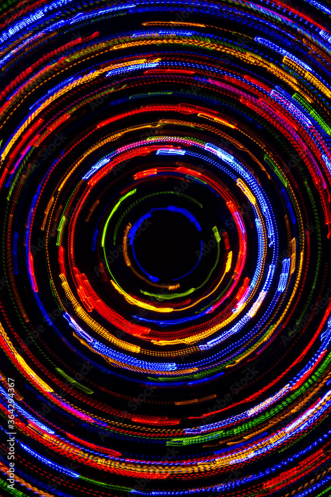 Rotating neon lights, spinning bright colorful laser lights background ...