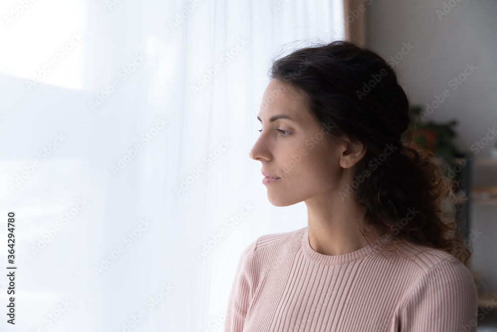 Thoughtful millennial Caucasian girl look in window distance thinking or pondering, pensive young woman lost in thoughts, planning or visualizing, feeling lonely at home, missing lacking communication Thoughtful millennial Caucasian girl look in window distance thinking or pondering, pensive young woman lost in thoughts, planning or visualizing, feeling lonely at home, missing lacking communication
