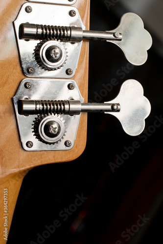 Bass guitar machine heads or tuning legs.