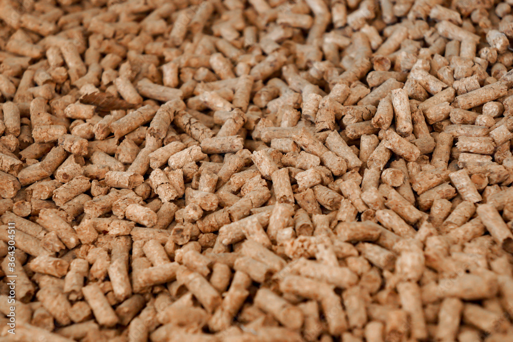 close up to Wood Pellet pile for alternative energy power, raw material background. close up to Wood Pellet pile for alternative energy power, raw material background.