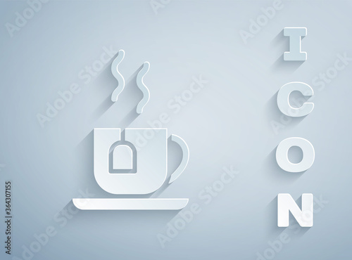 Paper cut Cup of tea with tea bag icon isolated on grey background. Paper art style. Vector.