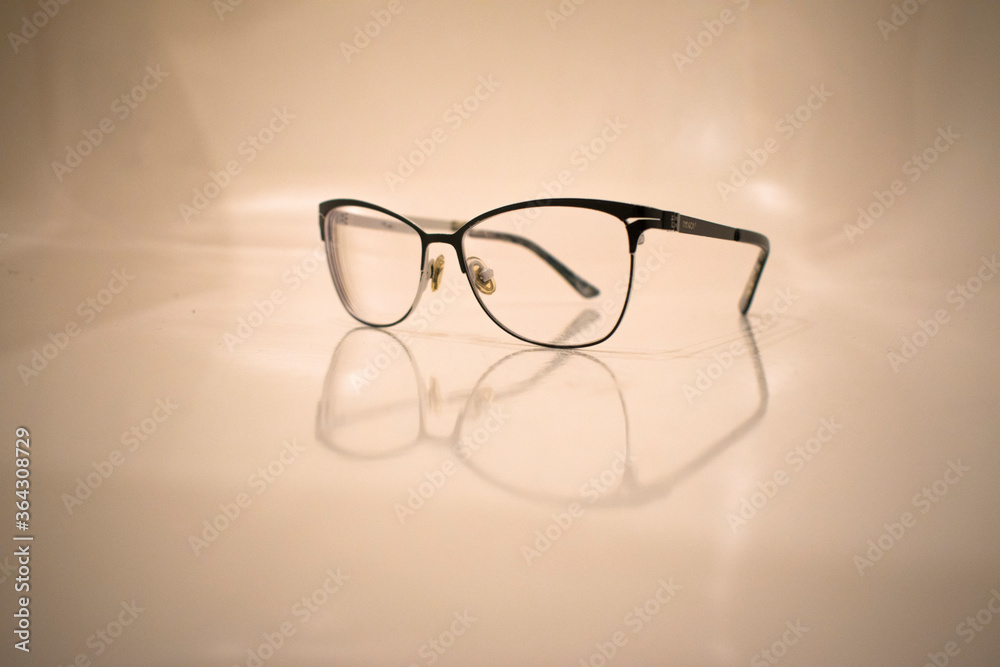 glasses with black frames on a light background glasses with black frames on a light background