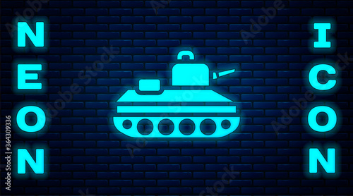 Glowing neon Military tank icon isolated on brick wall background. Vector.