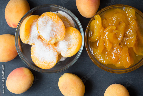 Apricot halves with sugar and jam in glass bowls. Steps for maki