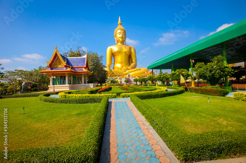 Beautiful of Large golden sitting Buddha statue with background of blue sky at Wat Muang  temple ,Ang Thaong,Thailand