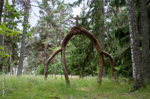 Wooden entrance gate with gross at The Island of Naissaar English military cemetery, Estonia photo