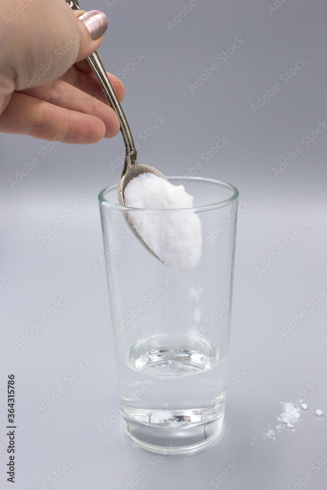 Transparent glass glass with water and white sorbent powder for ...