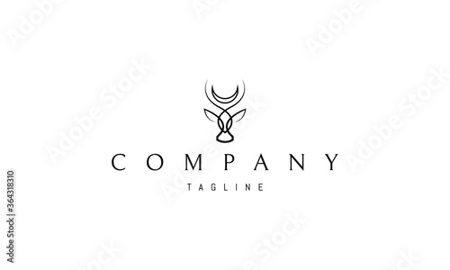 Vector logo on which an abstract image of the head of a bull with the moon over the horns.