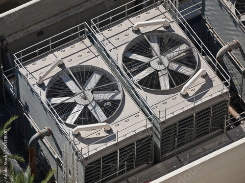 Down view towards large commercial air conditioner cooling fans. photo