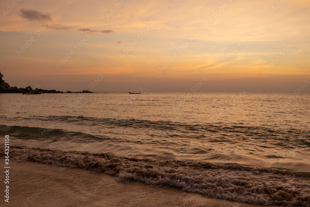 Landscape of sunset tropical beach in Phuket, Thailand