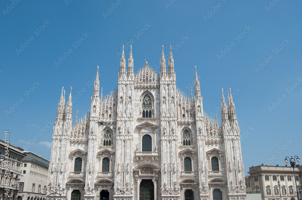 
facade of Milan cathedral with blue sky