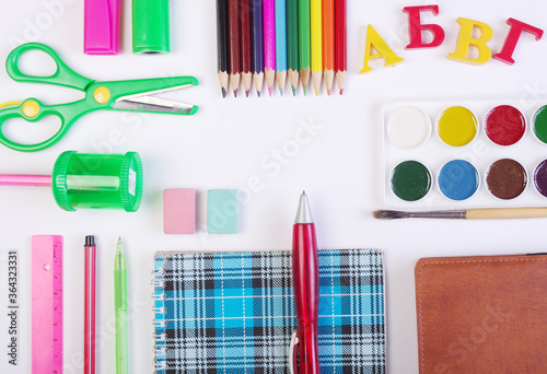 Hello school! A set of school supplies on the table. Notebook, pen, calculator, felt-tip pens and other accessories.