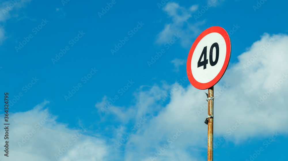 road sign speed limit on a blue sky background