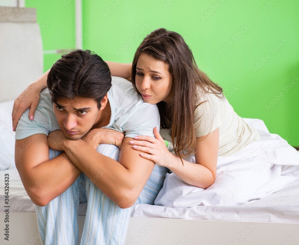 Young woman consoling disappointed impotent husband Young woman consoling disappointed impotent husband