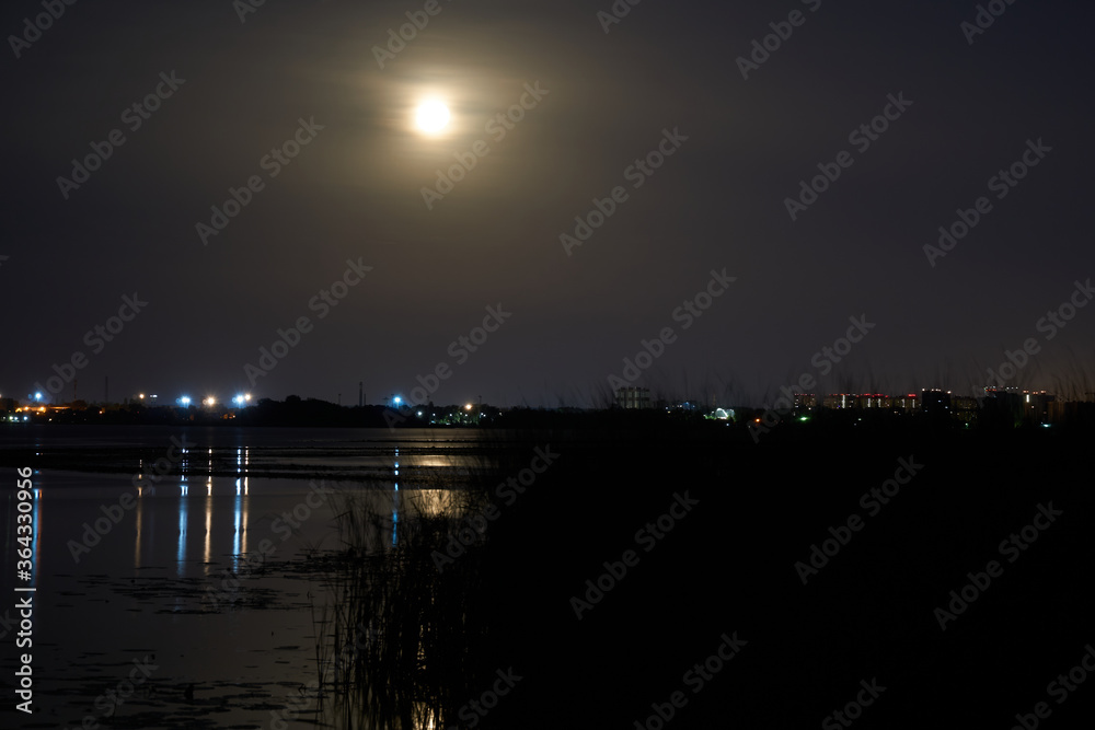 Night landscape with the moon over the Voronezh reservoir