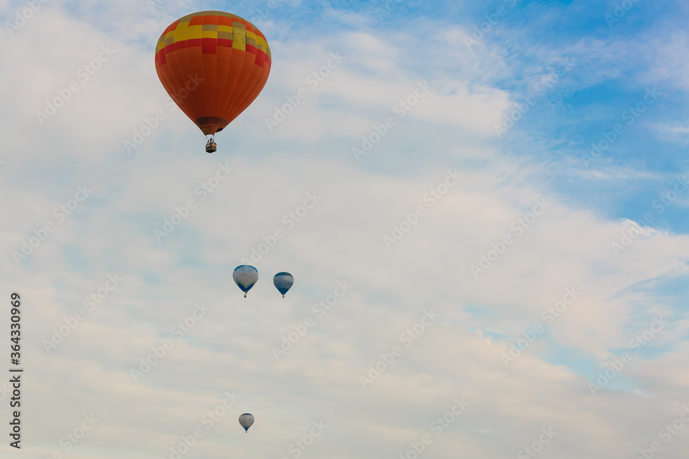 Fototapeta premium hot air balloon over blue sky. Composition of nature and blue sky background