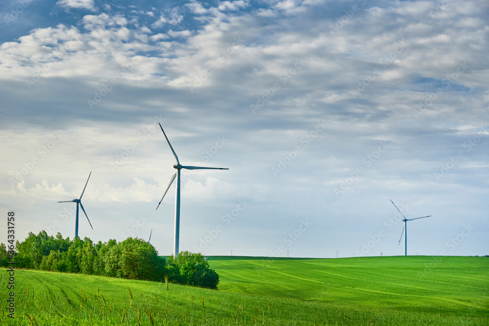 Wind turbine in the field. Wind power energy concept Wind turbine in the field. Wind power energy concept