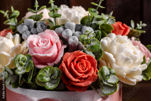 Bouquet of beautiful bright rose flowers in a gift cylindrical cardboard box