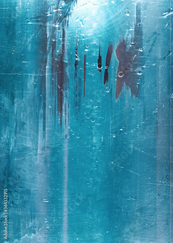 Blue abstract background. Distressed texture. Weathered scratched wet glass surface.