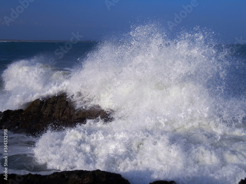 sea waves hitting rocks