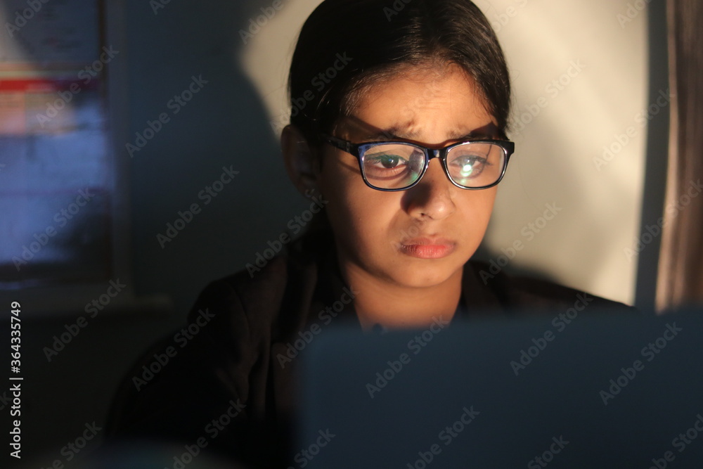 a girl working from home during global corona pandemic. a girl working from home during global corona pandemic.