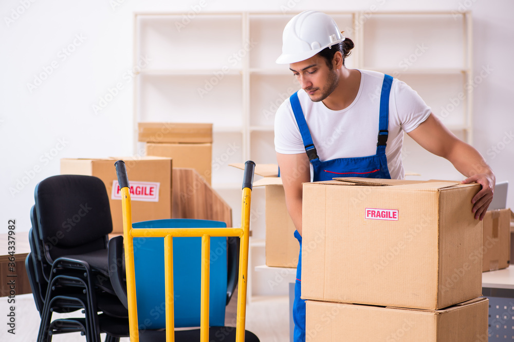 Young male professional mover doing home relocation