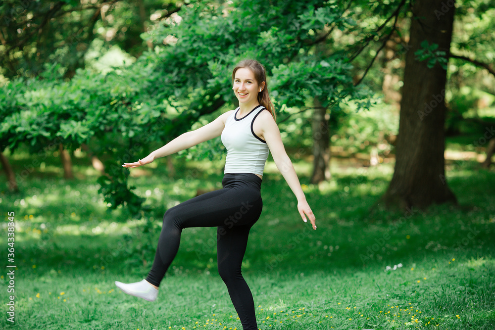 Athlete doing warm-up outdoors. Sports concept. women Athlete doing warm-up outdoors. Sports concept. women