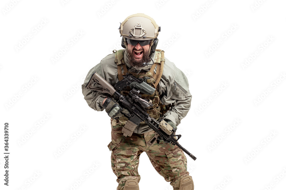 angry soldier in military equipment with a gun screaming on a white background, a commando in uniform with a rifle attacks in a rage