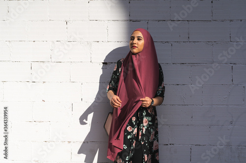 Photos Beautiful Muslim Girl Wearing Hiyab Over a White Wall Outdoors