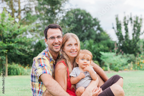 Happy young family in garden