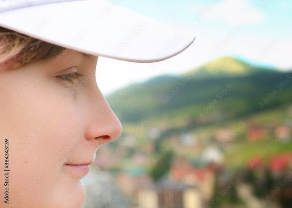 Girl's smiling face and beautiful mountain view