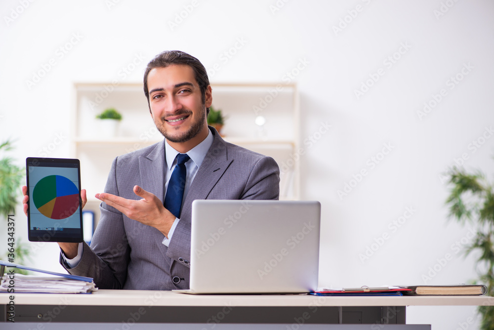Young businessman employee sitting in the office Young businessman employee sitting in the office
